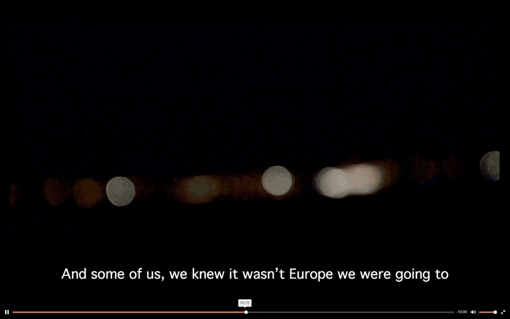 Screenshot from a video, black screen, text reads: "And some of us, we new it wasn't Europe we were going to"